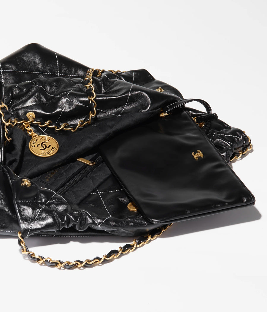 CHANEL 22 HANDBAG Shiny Calfskin & Gold-Tone Metal Black & White CHANEL 22 HANDBAG Shiny Calfskin & Gold-Tone Metal Black & White