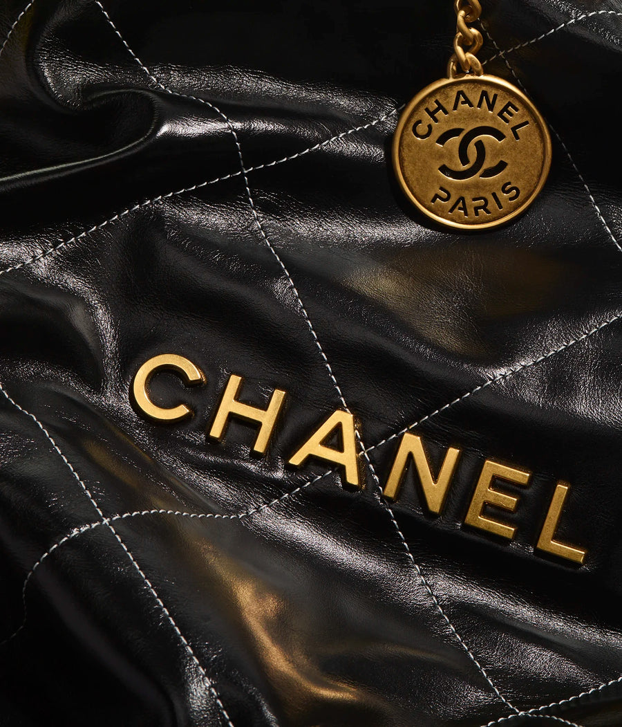 CHANEL 22 HANDBAG Shiny Calfskin & Gold-Tone Metal Black CHANEL 22 HANDBAG Shiny Calfskin & Gold-Tone Metal Black