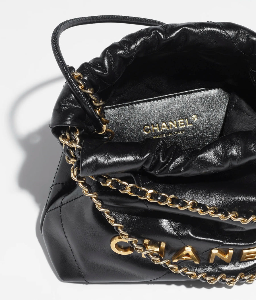 Mini shopping bag, Shiny aged calfskin & gold-tone metal, black — Fashion